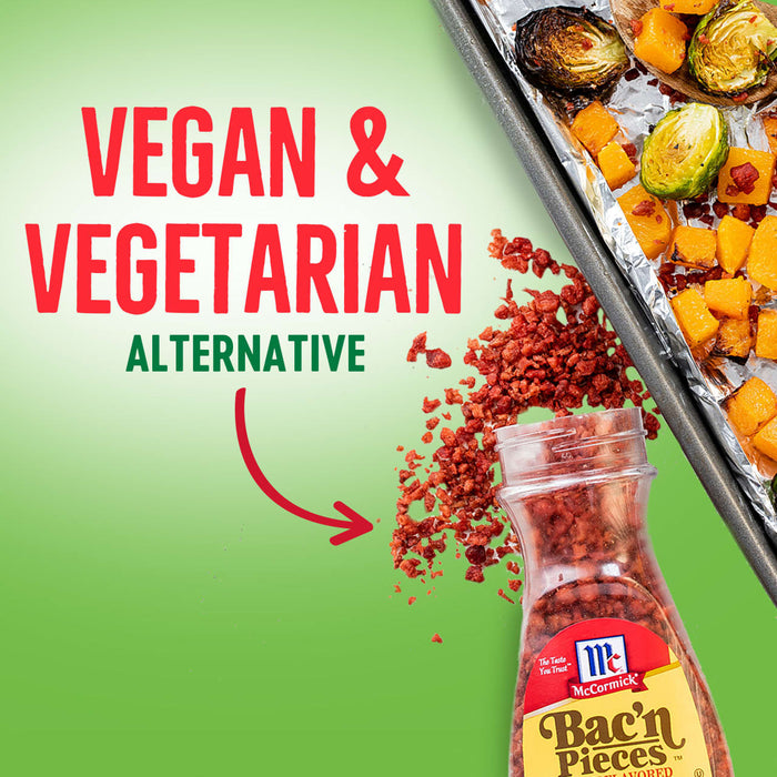 A jar of McCormick Bac'n Pieces with a red arrow pointing to it, and a baking sheet with roasted vegetables in the background.