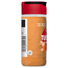 A glass jar of McCormick Turmeric Ground spice with a red lid and a barcode on the side.