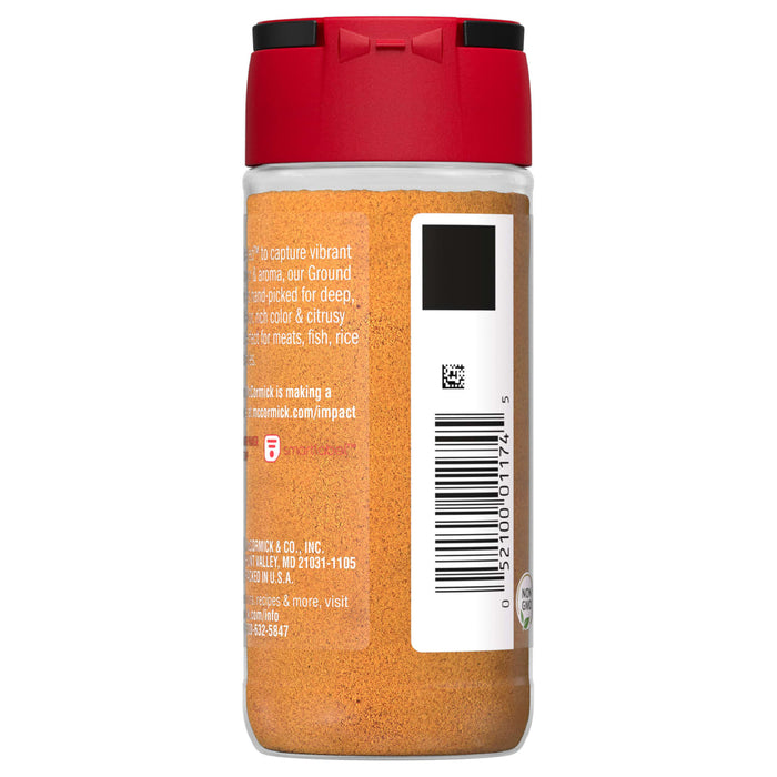 A glass jar of McCormick Ground Turmeric.