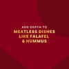 This image promotes adding depth to meatless dishes like falafel and hummus.
