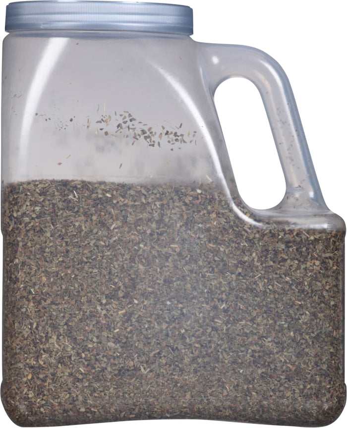 A clear plastic jar filled with dried herbs.