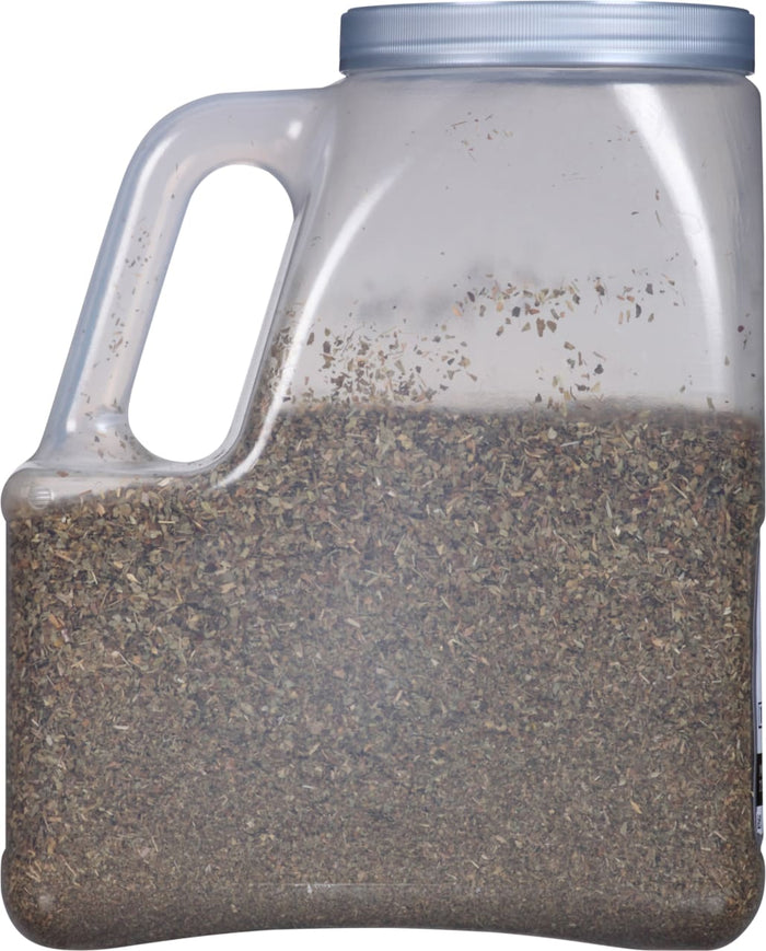 A clear plastic jar filled with dried herbs.