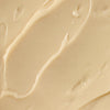 A close-up of a creamy, beige substance.