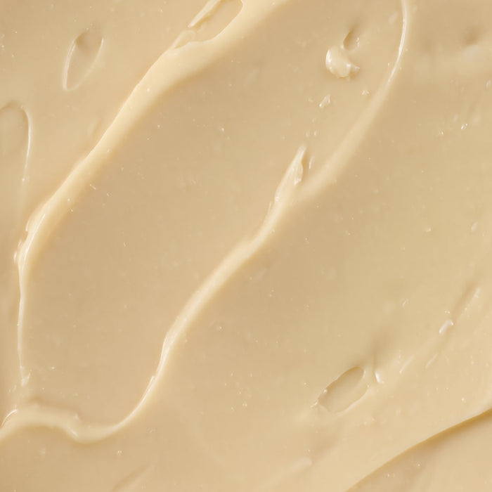 A close-up of a creamy, beige substance.