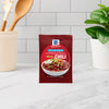 A packet of McCormick Chili Seasoning Mix is displayed on a kitchen counter.