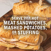 A close-up of a hot meat sandwich with melted cheese and gravy, suggesting it can be served over mashed potatoes or stuffing.