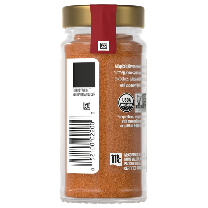 A jar of McCormick Organic Chili Powder with a label showing the product information and barcode.