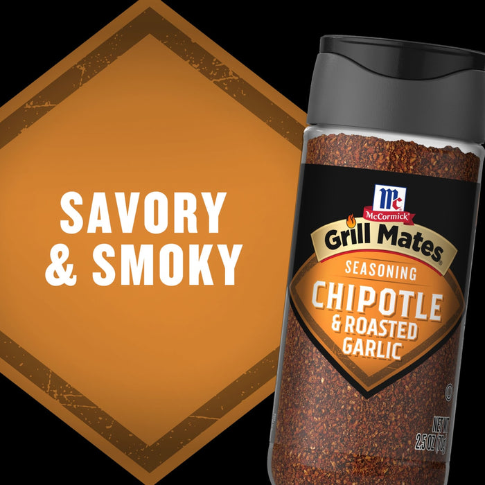 A bottle of McCormick Grill Mates Chipotle &amp; Roasted Garlic seasoning is displayed with the words Savory &amp; Smoky in the background.