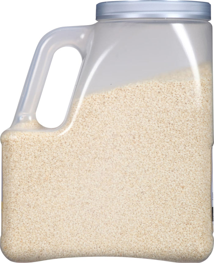 A plastic container filled with white sesame seeds.
