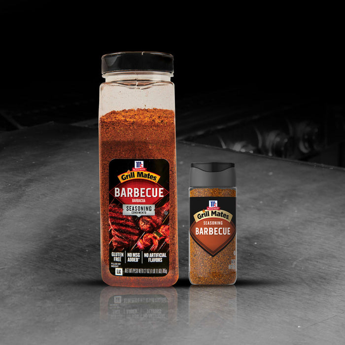 Two containers of Kosmos Q Dirty Bird BBQ Rub are displayed, showcasing the product's packaging and size variations.