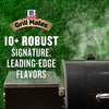A close-up of a grill with smoke rising, advertising Grill Mates and their 10+ robust signature, leading-edge flavors.