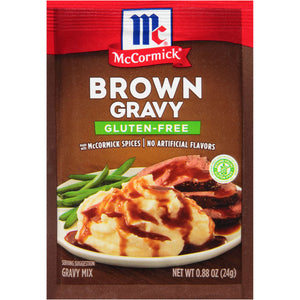A McCormick Brown Gravy mix package with a serving suggestion of mashed potatoes green beans and roast beef.