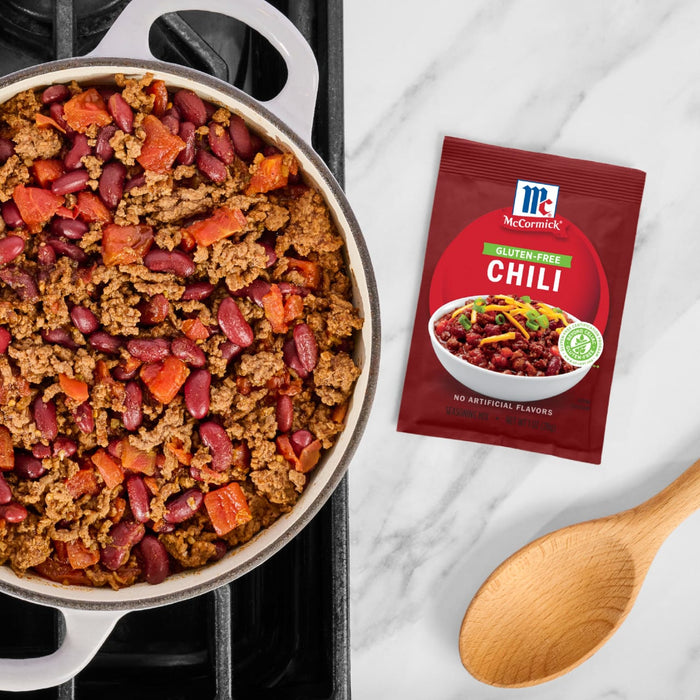 A pot of chili made with McCormick Chili seasoning is shown next to a packet of the seasoning.