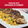 A plate of sliced grilled chicken or turkey served with a vibrant mango salsa.