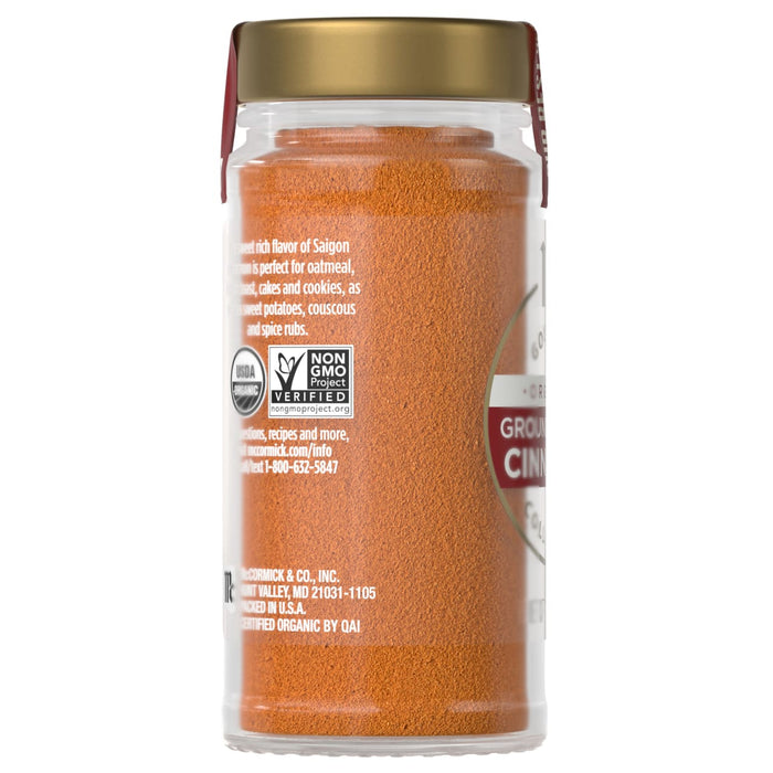 A jar of McCormick Ground Cinnamon, a non-GMO and USDA organic product.