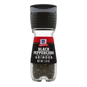 A McCormick Black Peppercorn Adjustable Grinder with black peppercorns inside.