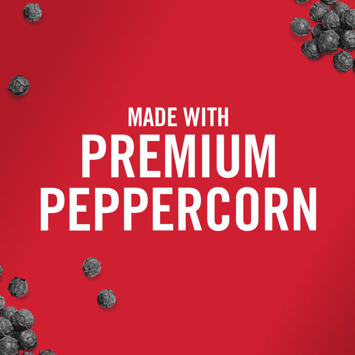 Black peppercorns scattered around the text Made with Premium Peppercorn on a red background.