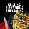 A plate of grilled cabbage wedges topped with bacon and blue cheese crumbles, showcasing grilling, air-frying, and pan-searing cooking methods.