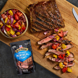 A grilled steak seasoned with McCormick Grill Mates Montreal Steak seasoning is served with a colorful vegetable salsa.