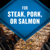 This image showcases grilled steak, pork, or salmon, suggesting a versatile seasoning or marinade suitable for various meats and fish.