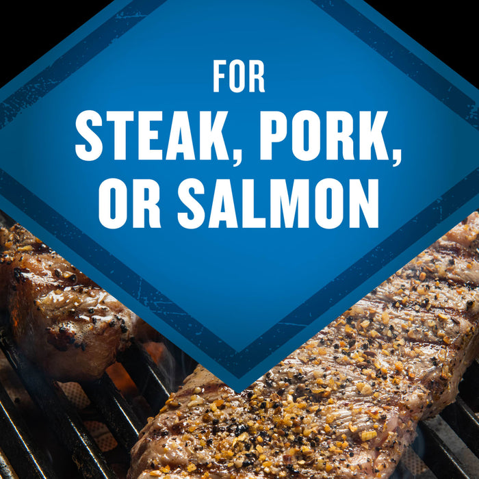 This image showcases grilled steak, pork, or salmon, suggesting a versatile seasoning or marinade suitable for various meats and fish.