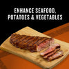 A grilled steak, sliced on a wooden cutting board, is shown to represent enhancing seafood, potatoes, and vegetables.