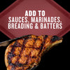 A grilled chop is held by tongs, with text overlayed saying Add to Sauces, Marinades, Breading &amp; Batters.