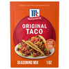A red and orange packet of Mccormick Taco Seasoning Mix, featuring two prepared tacos filled with seasoned ground meat, lettuce, tomatoes, and shredded cheese on a white plate.