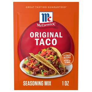 A red and orange packet of Mccormick Taco Seasoning Mix, featuring two prepared tacos filled with seasoned ground meat, lettuce, tomatoes, and shredded cheese on a white plate.