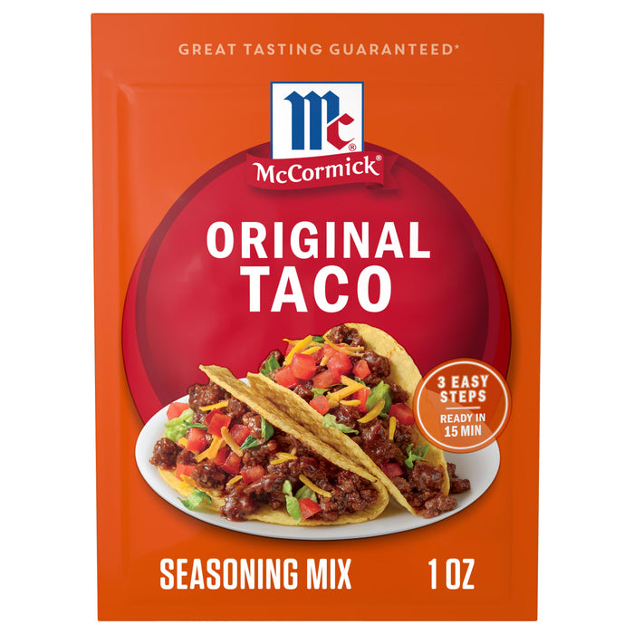 A red and orange packet of Mccormick Taco Seasoning Mix, featuring two prepared tacos filled with seasoned ground meat, lettuce, tomatoes, and shredded cheese on a white plate.