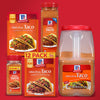 A variety of McCormick Original Taco seasoning mixes including a 12-pack a 6-lb container and a smaller jar.