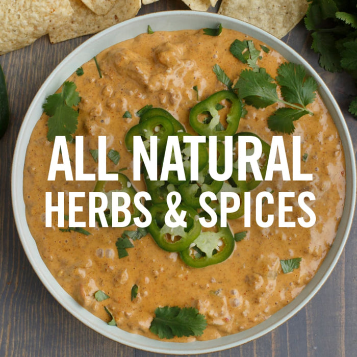 A bowl of cheesy dip with jalapenos and cilantro with the text All Natural Herbs &amp; Spices on top.