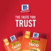 Two McCormick Mild Taco seasoning packets with a red background and the slogan The Taste You Trust.