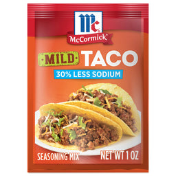 McCormick Mild Taco Seasoning Mix with 30% less sodium with a picture of two tacos on a white plate.