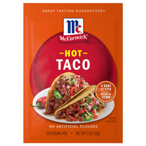 A package of Mccormick Hot Taco Seasoning Mix 1 Oz featuring two prepared tacos filled with seasoned meat and fresh toppings on a bright orange background.