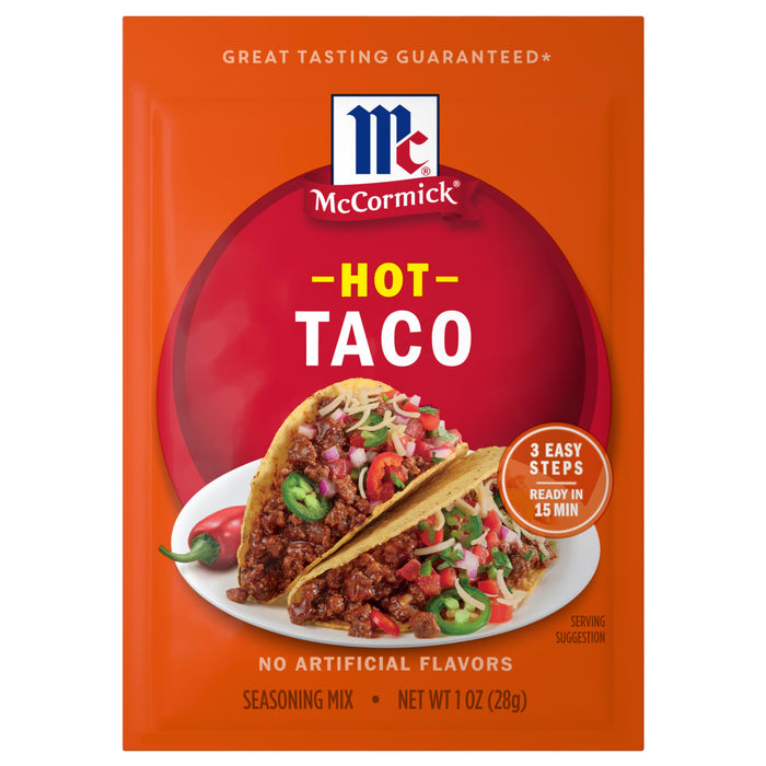 A package of Mccormick Hot Taco Seasoning Mix 1 Oz featuring two prepared tacos filled with seasoned meat and fresh toppings on a bright orange background.