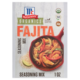 A packet of Mccormick Organics Regular Fajita Seasoning Mix 1 Oz is displayed in front of a red skillet filled with cooked chicken and vegetable fajitas, highlighting its use.