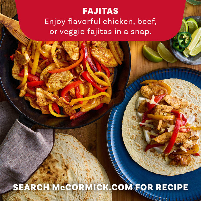 A skillet of chicken fajitas and a prepared fajita on a tortilla demonstrate a delicious meal idea using Mccormick Organics Regular Fajita Seasoning Mix 1 Oz.