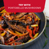 A close-up of a skillet with delicious portobello mushroom fajitas, a great vegetarian option to make with Mccormick Organics Regular Fajita Seasoning Mix 1 Oz.
