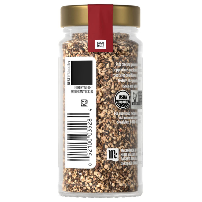 A jar of McCormick Organic Toasted Sesame Seeds with a gold lid and a red label.