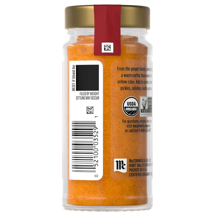 A jar of McCormick organic turmeric is displayed, showing the product's packaging and color.