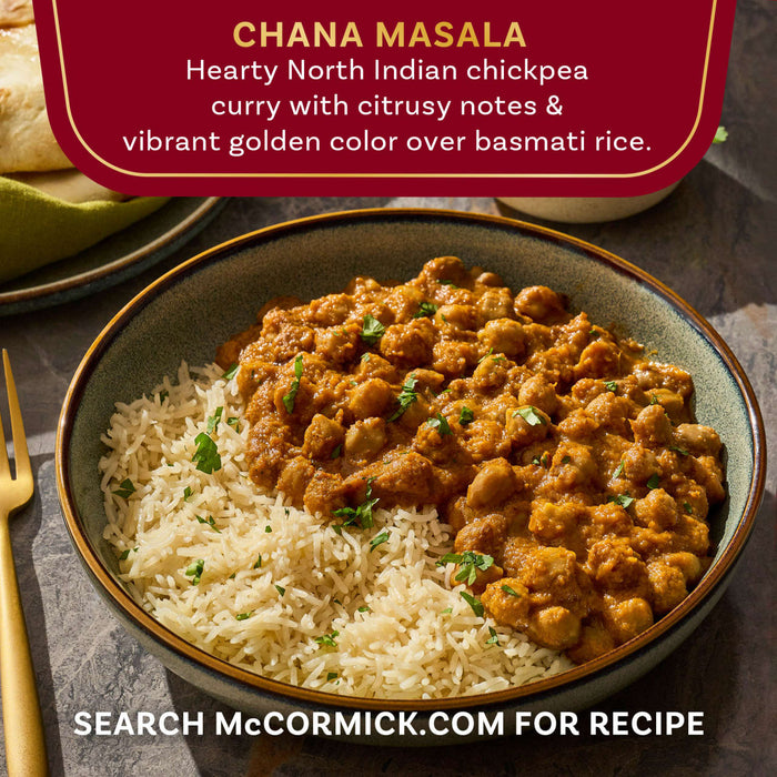 A bowl of McCormick Chana Masala, a hearty North Indian chickpea curry with basmati rice, showcasing its vibrant golden color.