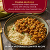 A bowl of McCormick Chana Masala, a hearty North Indian chickpea curry with basmati rice, showcasing its vibrant golden color.
