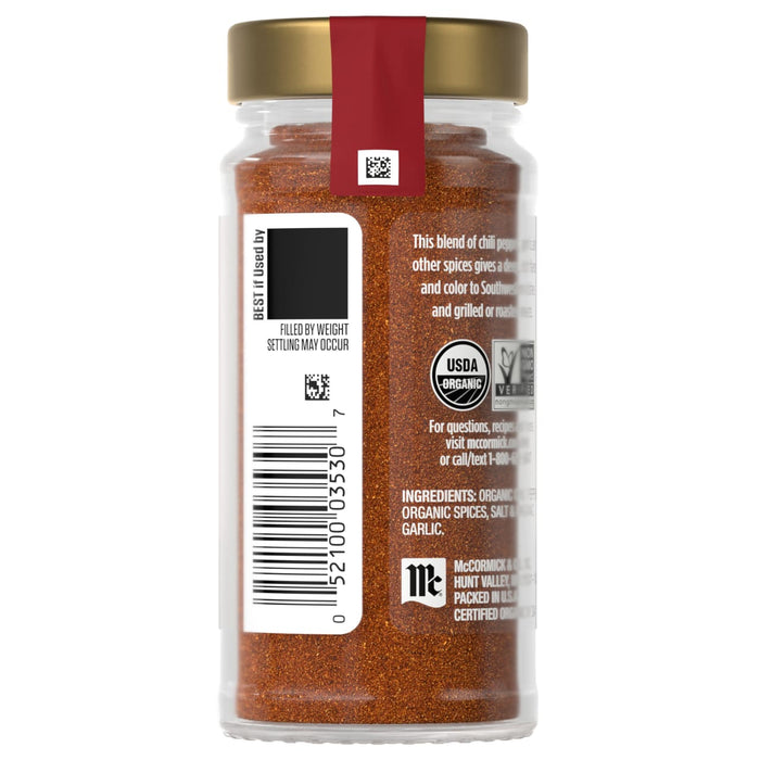 A jar of McCormick Organic Chili Powder with a gold lid and a red label.