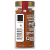 A jar of McCormick Organic Chili Powder with a gold lid and a red label.