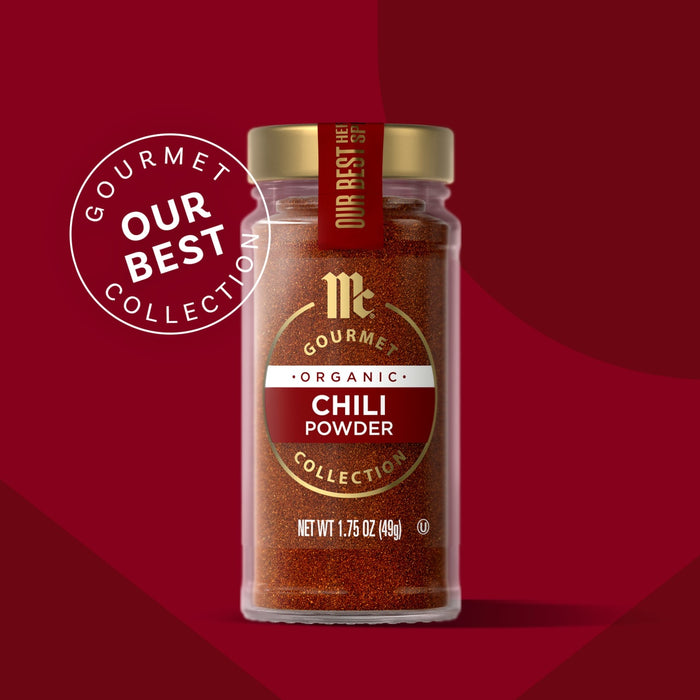 McCormick Gourmet Chili Powder in a glass jar with a gold lid, part of the Our Best Collection.