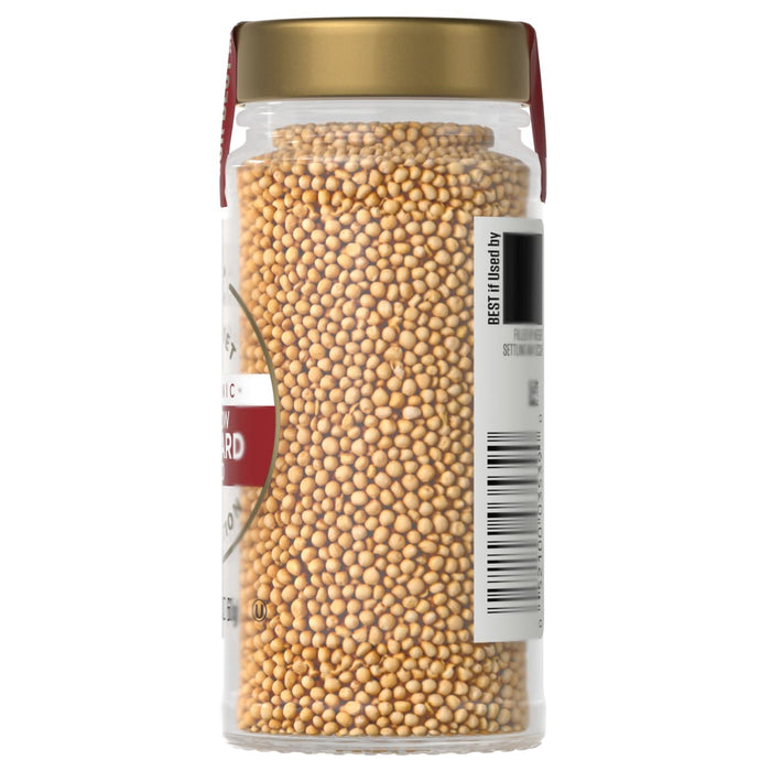 A jar of Maille mustard seeds, showcasing the product's texture and appearance.