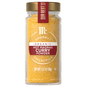 A jar of McCormick Gourmet Organic Hot Madras Curry Powder.