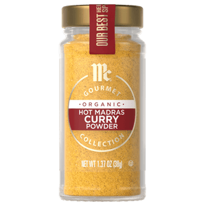 A jar of McCormick Gourmet Organic Hot Madras Curry Powder.