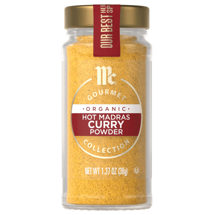 A jar of McCormick Gourmet Organic Hot Madras Curry Powder.
